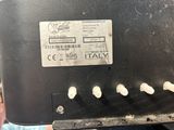 a label on the back of a toaster that says it ' s made in italy
