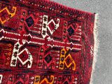 an image of a red rug with a pattern on it