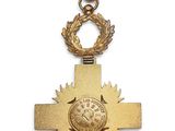a close up of a cross with a crown on it
