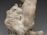 an image of a sculpture of a bear and a bear cub on a rock