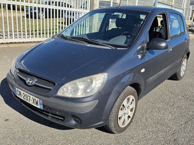 a picture of a small car parked in a parking lot