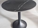 a black table with a marble top on a white background