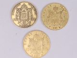 three gold coins with a coat of arms on them