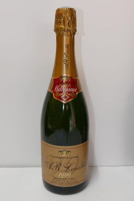 a bottle of champagne sitting on a white table