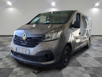 the grey van is parked in the garage on the checkered floor
