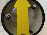 a yellow arrow that is on the side of a machine