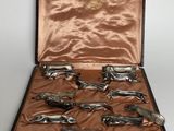 a case that has a bunch of silver spoons in it