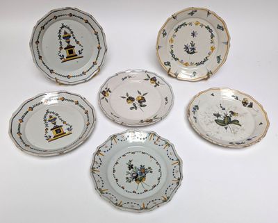 six plates with different designs on them on a white surface