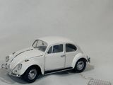 a toy car that is sitting on a white surface