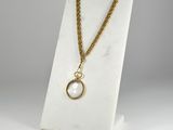 a white marble necklace with a gold chain and a pearl pendant