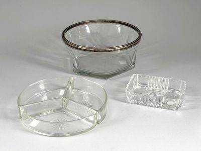 a glass bowl and a glass ashtray on a white surface