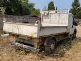 a white truck that is parked in a field