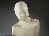 marble bust of a boy on a block