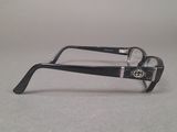 glasses with black frames on a gray surface with a white background