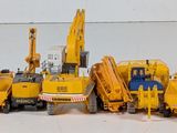 a lot of toy trucks that are lined up together