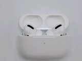 two airpods sitting on top of a white box