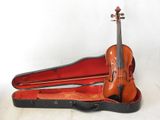 a violin in a case with a bow in it