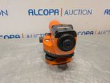 a close up of an orange camera on a metal surface