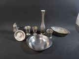 a lot of silver items that are on the table