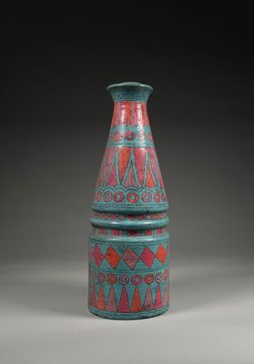 an image of a blue and red vase sitting on top of a table