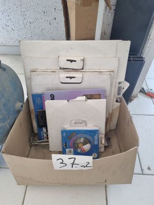 a cardboard box filled with books and other items