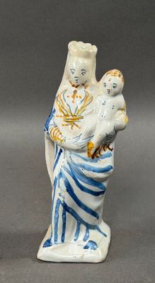 a figurine of a woman holding a child