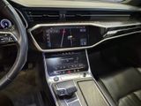 the interior of a car with a steering wheel and dashboard controls