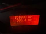 a close up of a digital clock on a car ' s dashboard