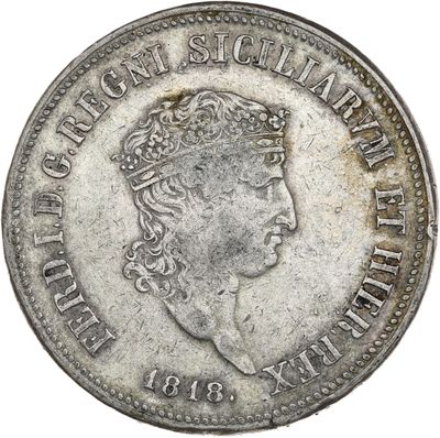 gros plan d'une pièce de monnaie sur laquelle figure une tête de femme