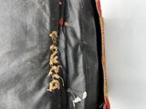 a close up of a piece of cloth with a flower on it