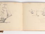 an open book with a drawing of a sailboat on it