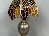 an image of a lamp with a stained glass shade on it