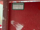 a sign on a red wall that says approval for support