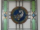 a picture of a stained glass window hanging on the wall