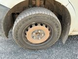 a flat tire on a white car with a flat tire