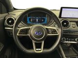 the interior of a car with a steering wheel, dashboard, and touch screen