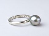 an image of a ring with a pearl on it
