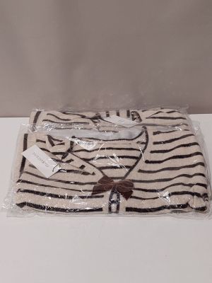 a zebra print shirt wrapped in plastic on a table