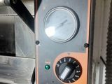 an image of a close up of a machine with a clock