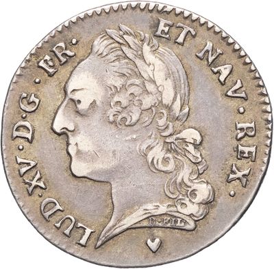 gros plan d'une pièce de monnaie sur laquelle figure une tête de femme