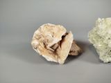 two different types of rocks on a gray surface
