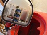 a close up of a red kayak with a switch on it