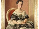 portrait of a woman in a green and white dress sitting on a red chair