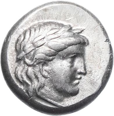 a close up of a coin with a woman ' s head on it