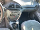 a dashboard of a car with a steering wheel and a control panel