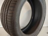 a close up of a tire on a white surface