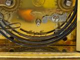 a close up of a gold clock with a clock face