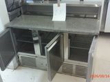 an image of a kitchen with a refrigerator and a counter top