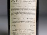 a label on a bottle of wine on a table