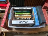 a stack of books sitting on top of a wooden table
